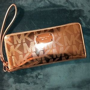 Large rose gold Michael Kors wristlet wallet.
